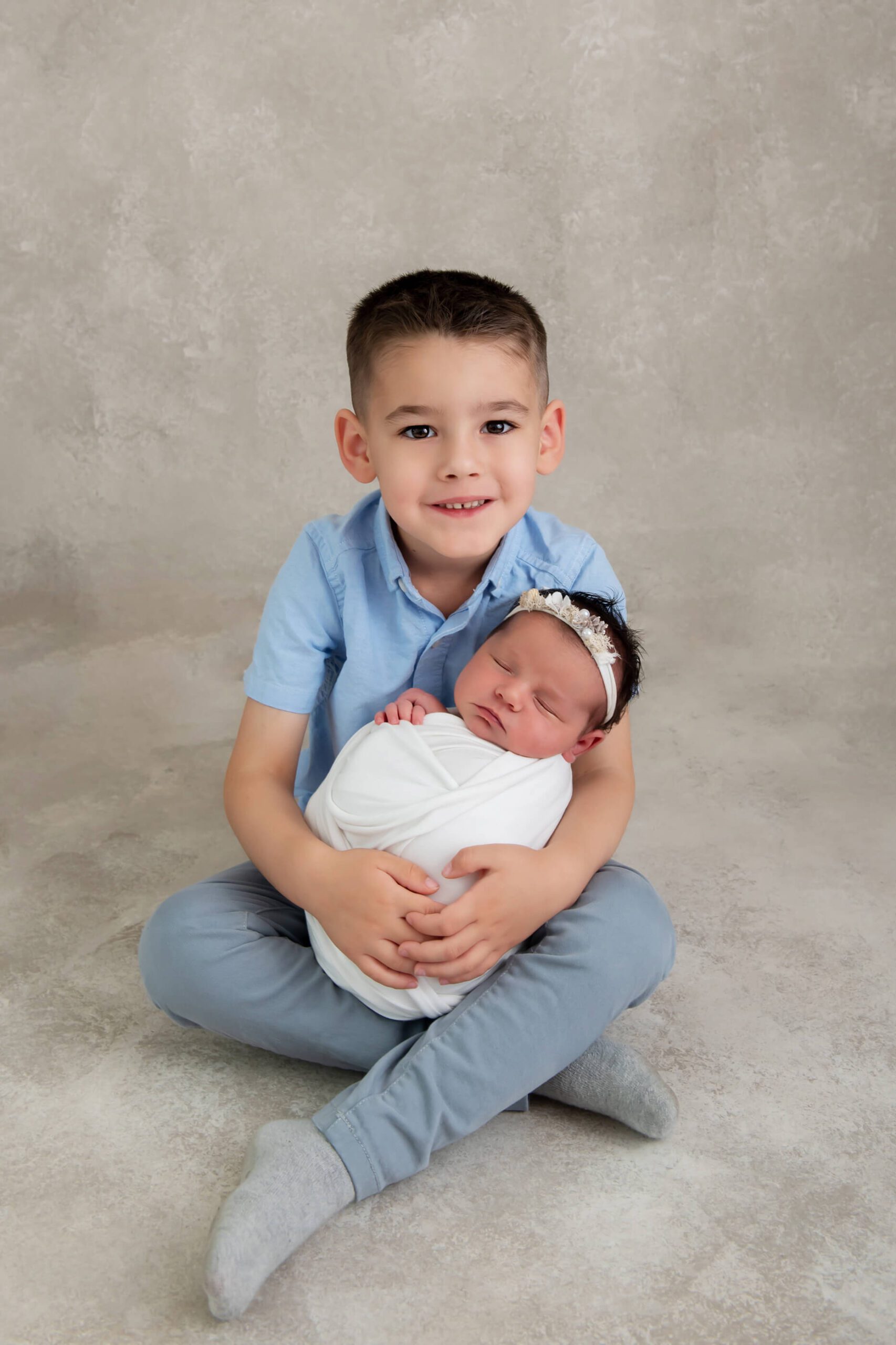 sibling brother with newborn sister