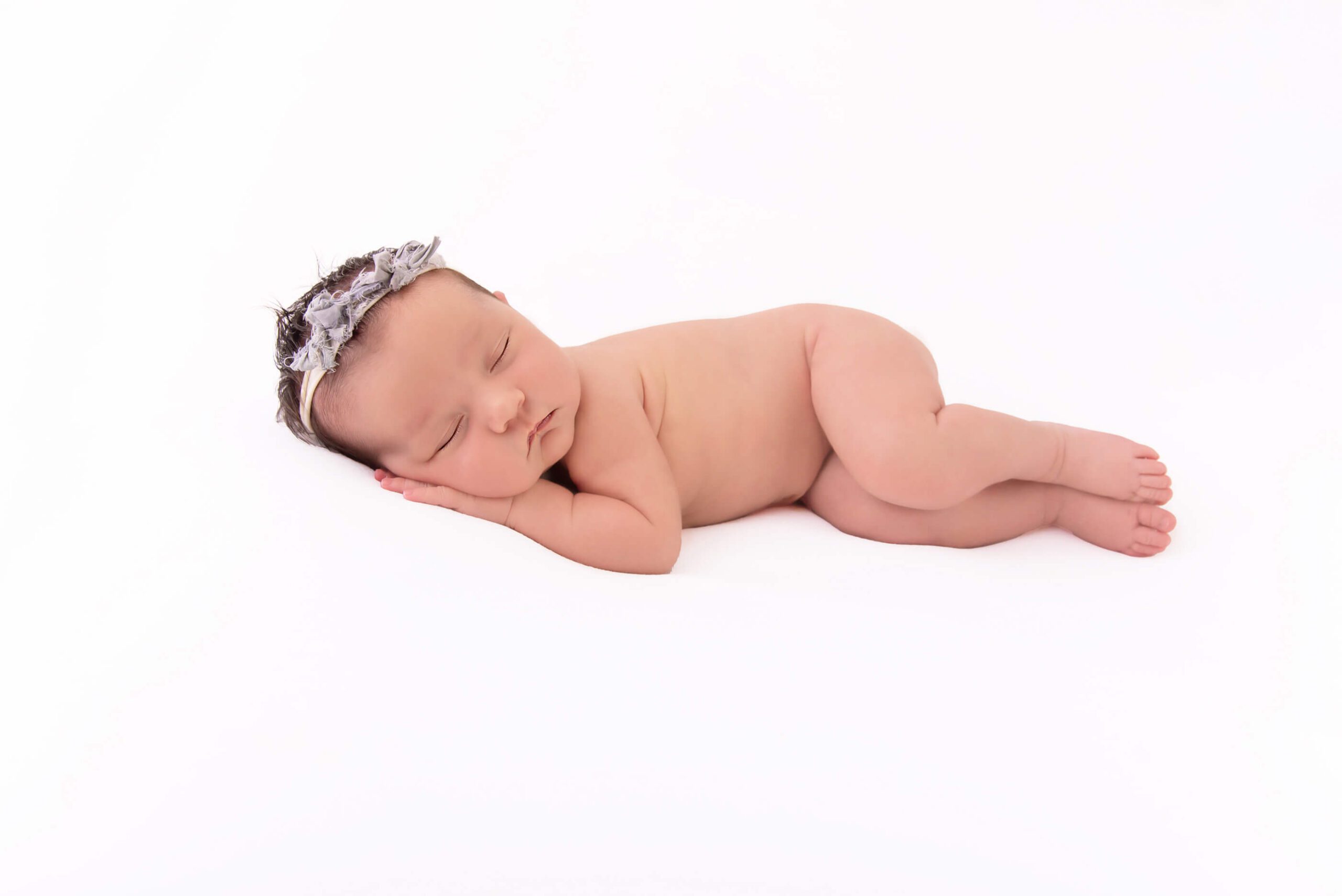 side laying newborn photography pose
