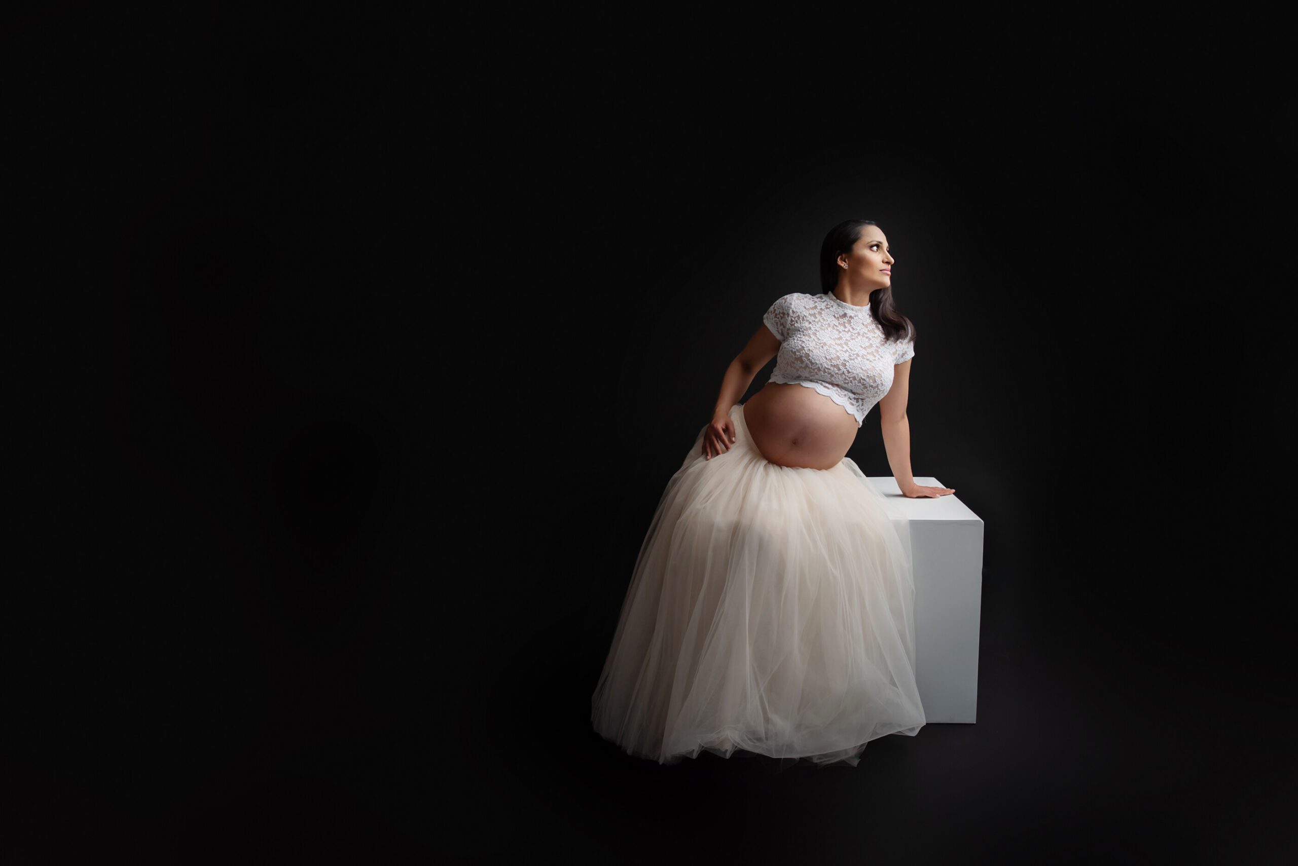Burlington maternity photographer with mom to be in-studio with posing block