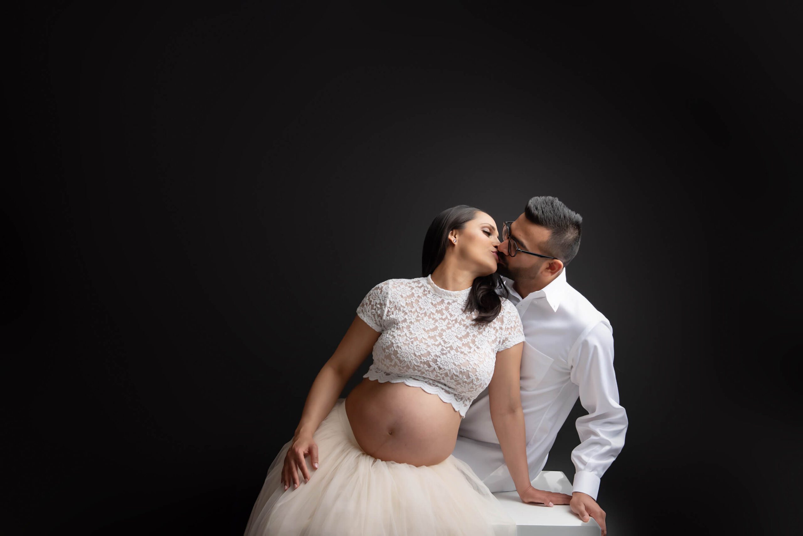 Burlington in-studio maternity session with husband and wife on posing block