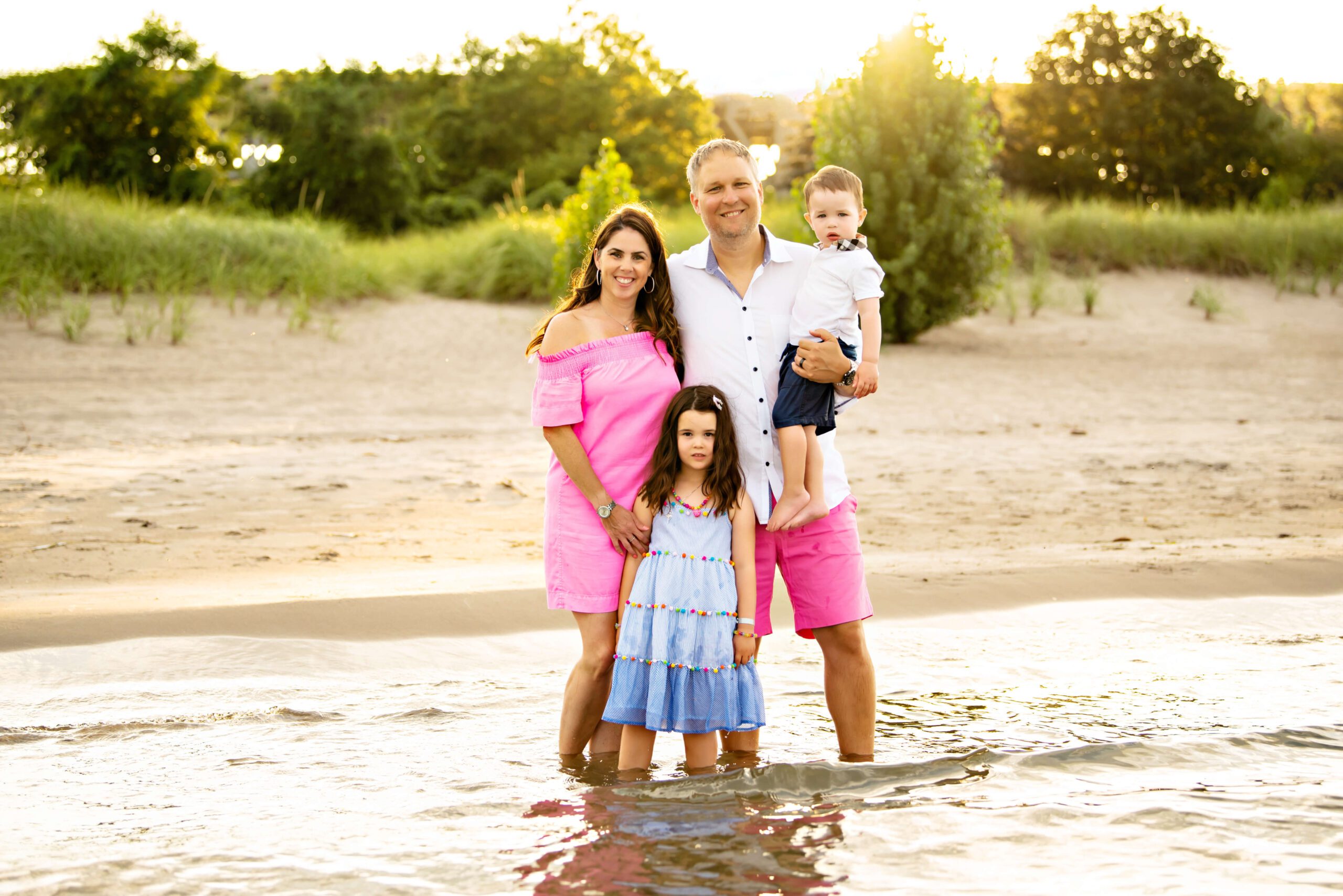 Outdoor beach with a family of four at the golden hour