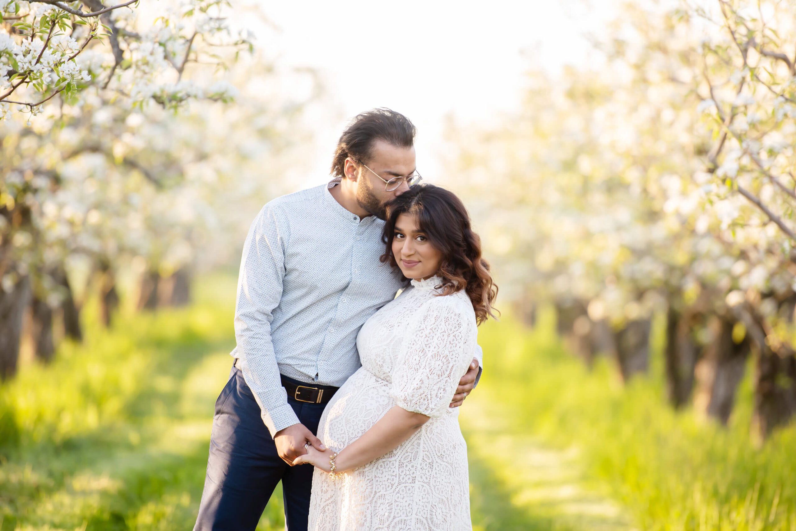 maternity photography session in the golden hour at the cherry blossom farm