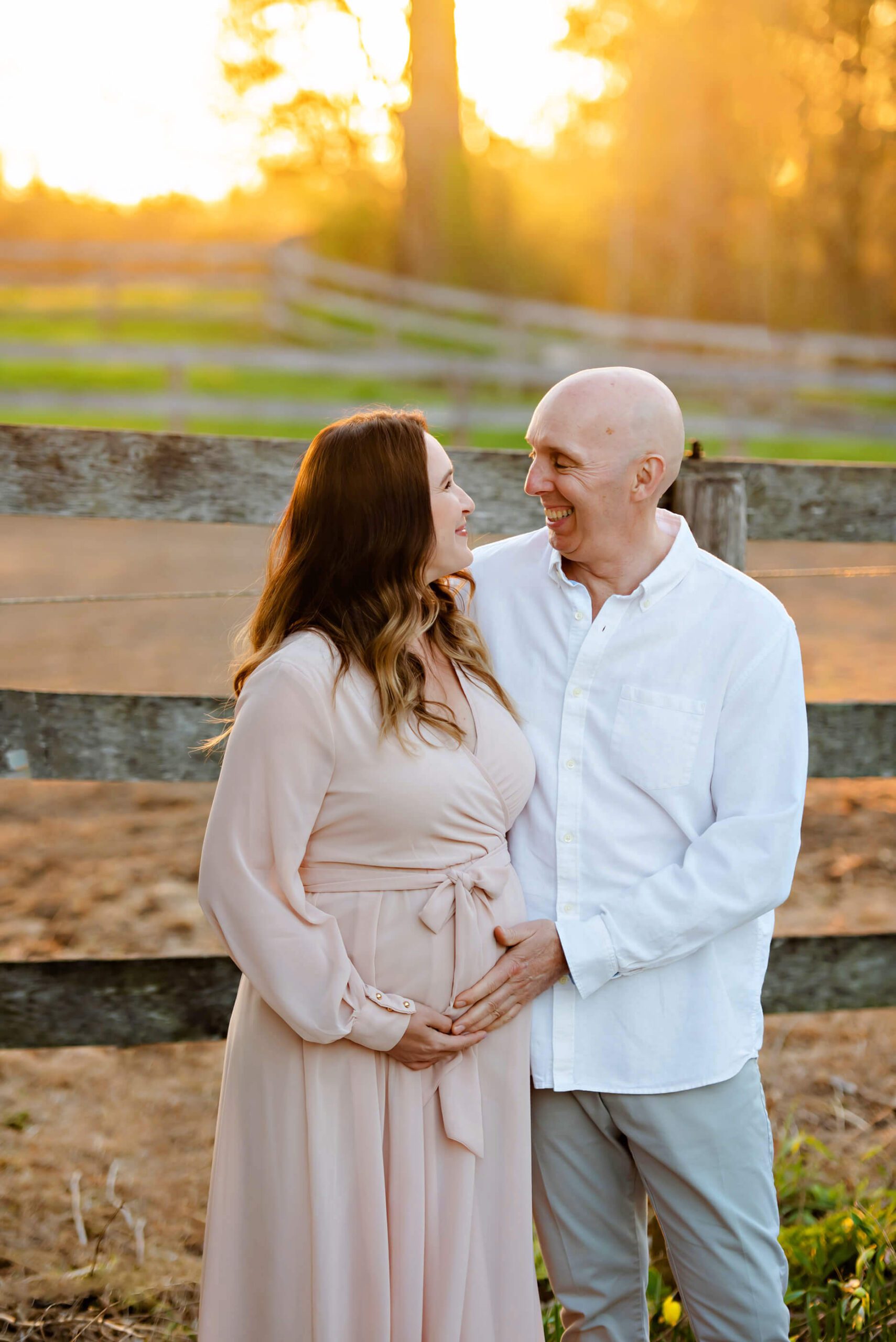 couple maternity photo at sunset at a farm in Milton