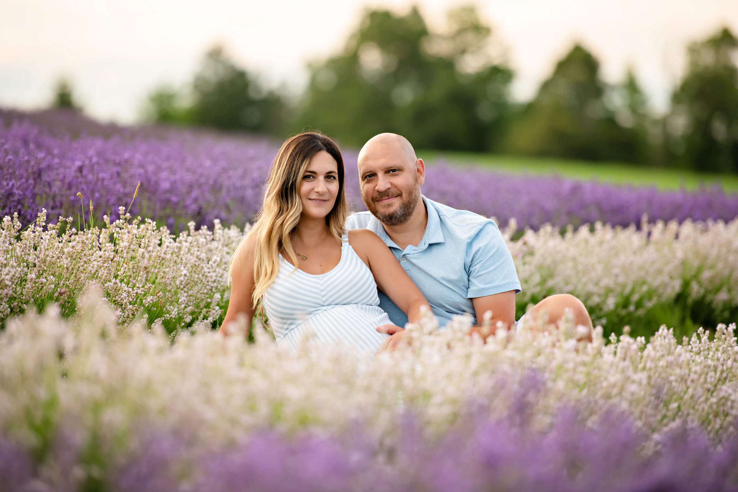 husband and wife in the lavender field for their Toronto maternity photography session