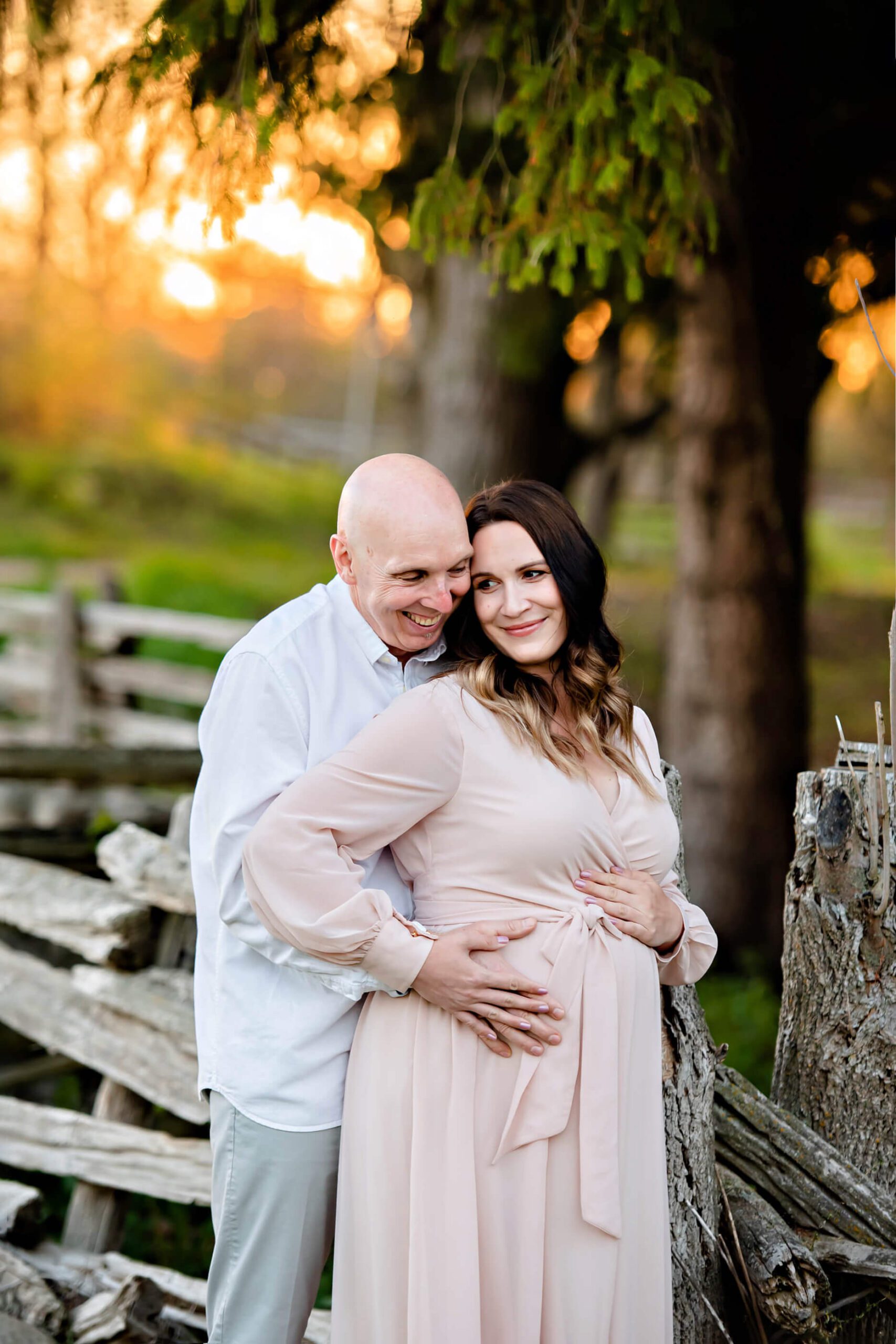 couple laughing at their maternity session Burlington