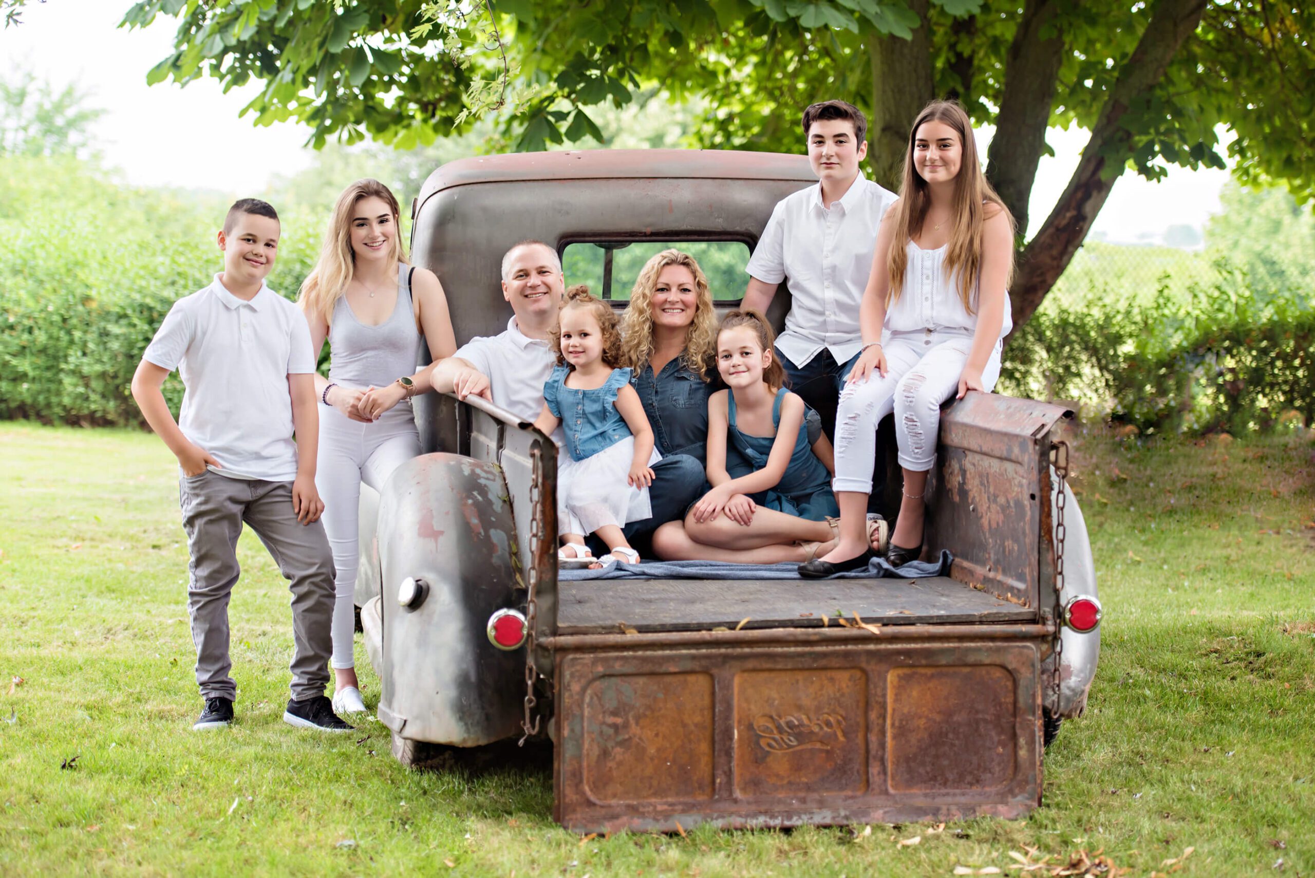 family of 8 on a vintage truck for the Hamilton family photography session