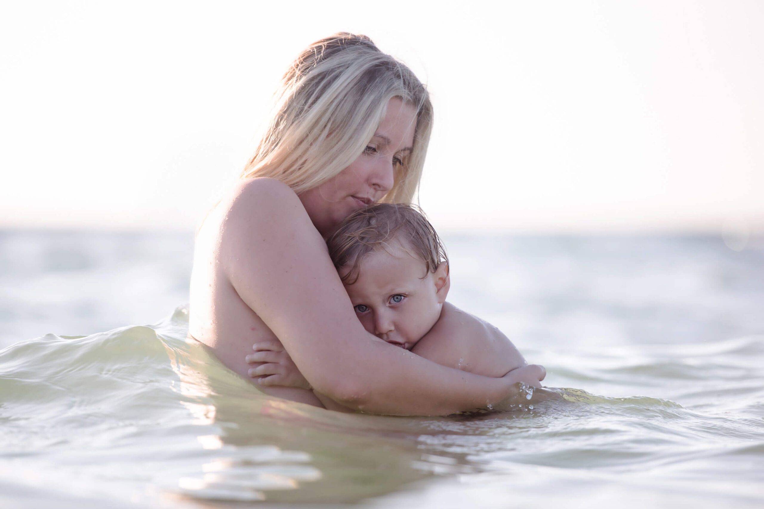 Breastfeeding mom in the ocean Toronto Lactation Consultant