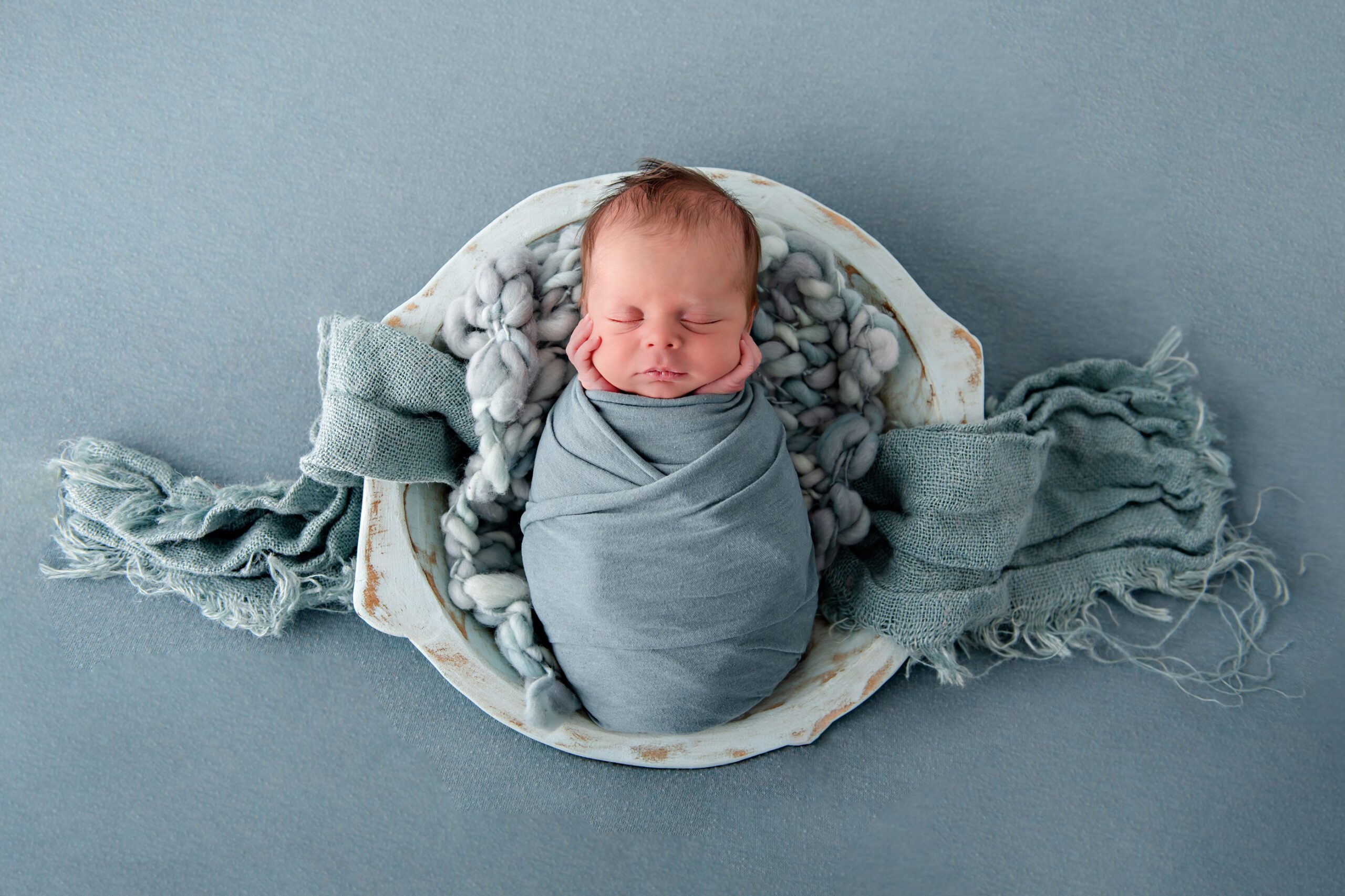 newborn boy in a bowl all blue set