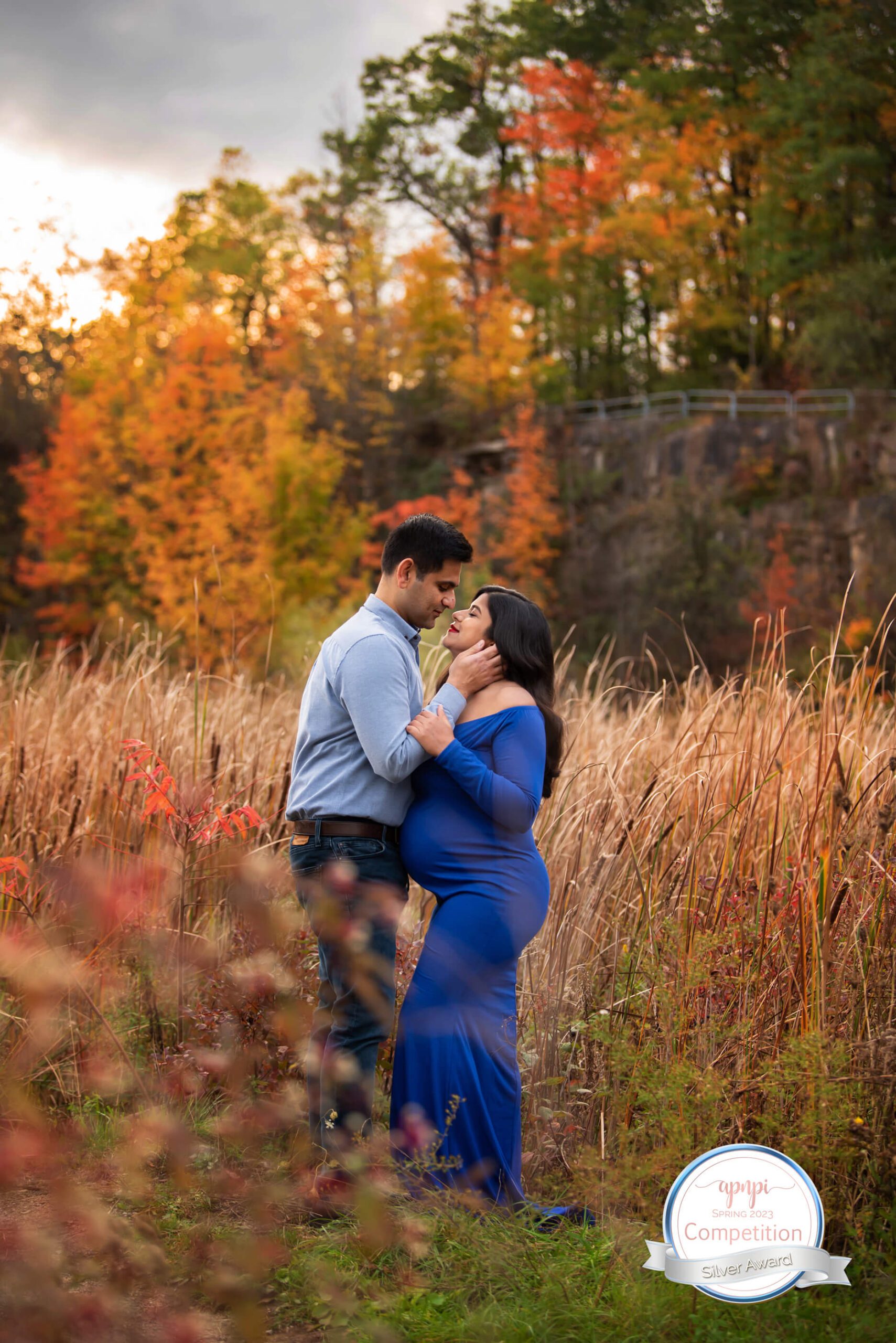 husband and wife award-winning image in the fall. Husband embracing wife's face, Hamilton, Ontario