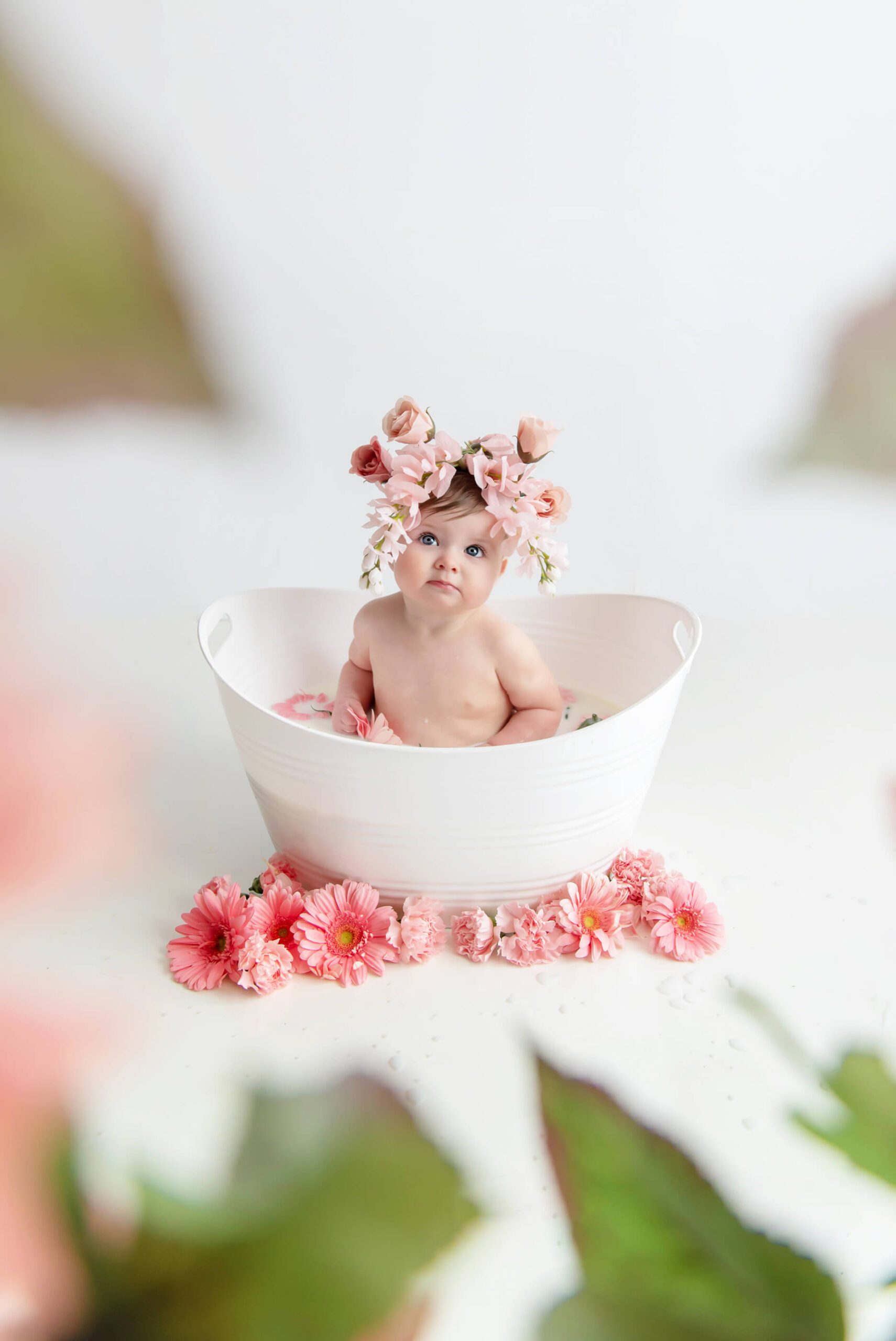 Milk Bath milestone photos with a little girl with pink flowers