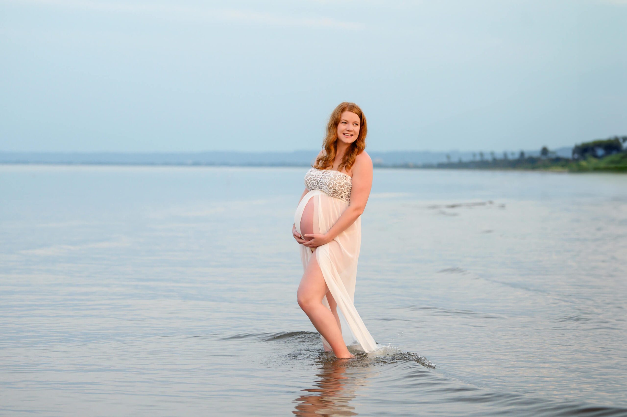 mom standing in the water at her Toronto Beach Maternity Session