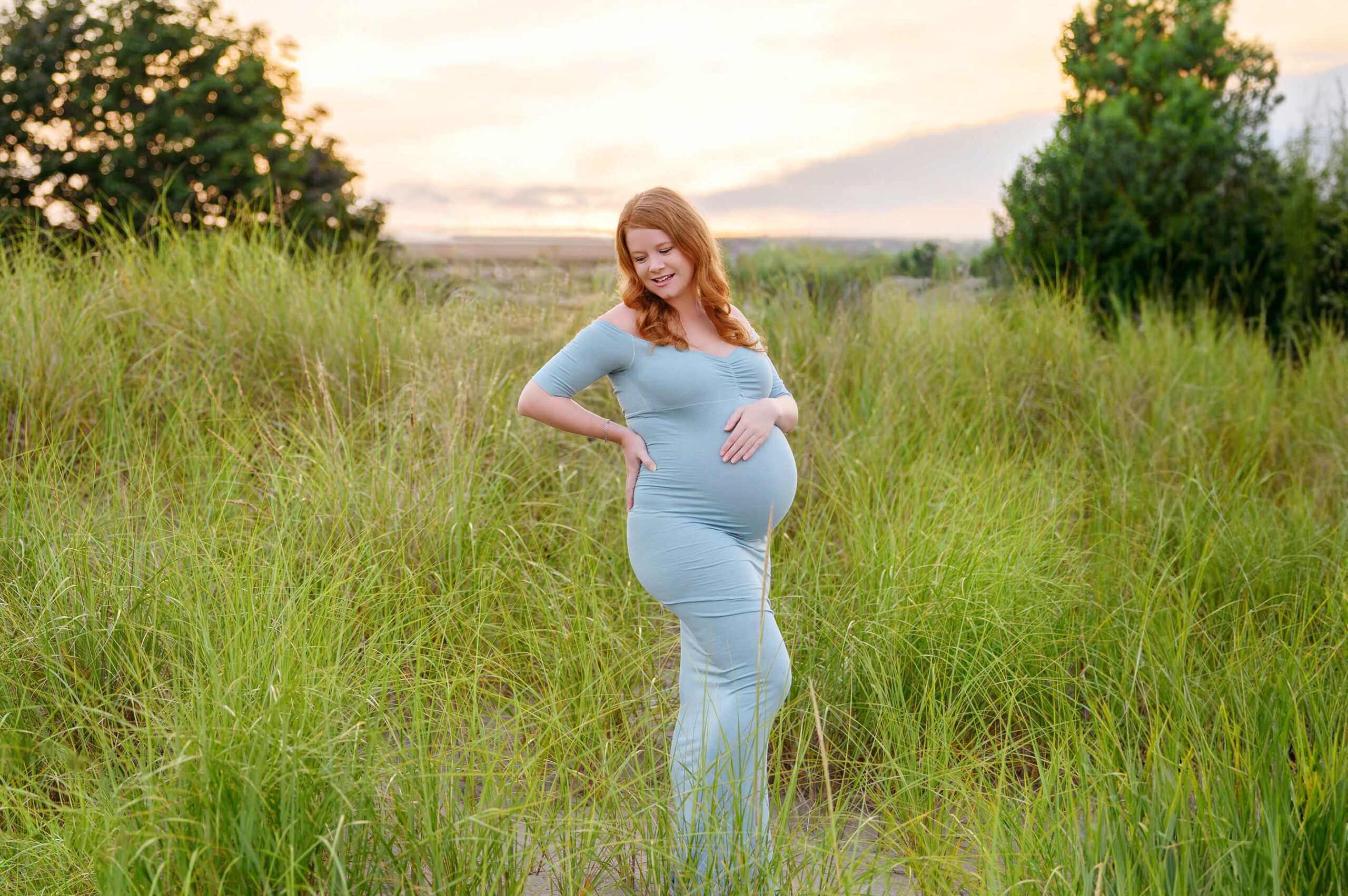 Gorgeous Golden light with mom holding her belly Toronto Maternity Photography