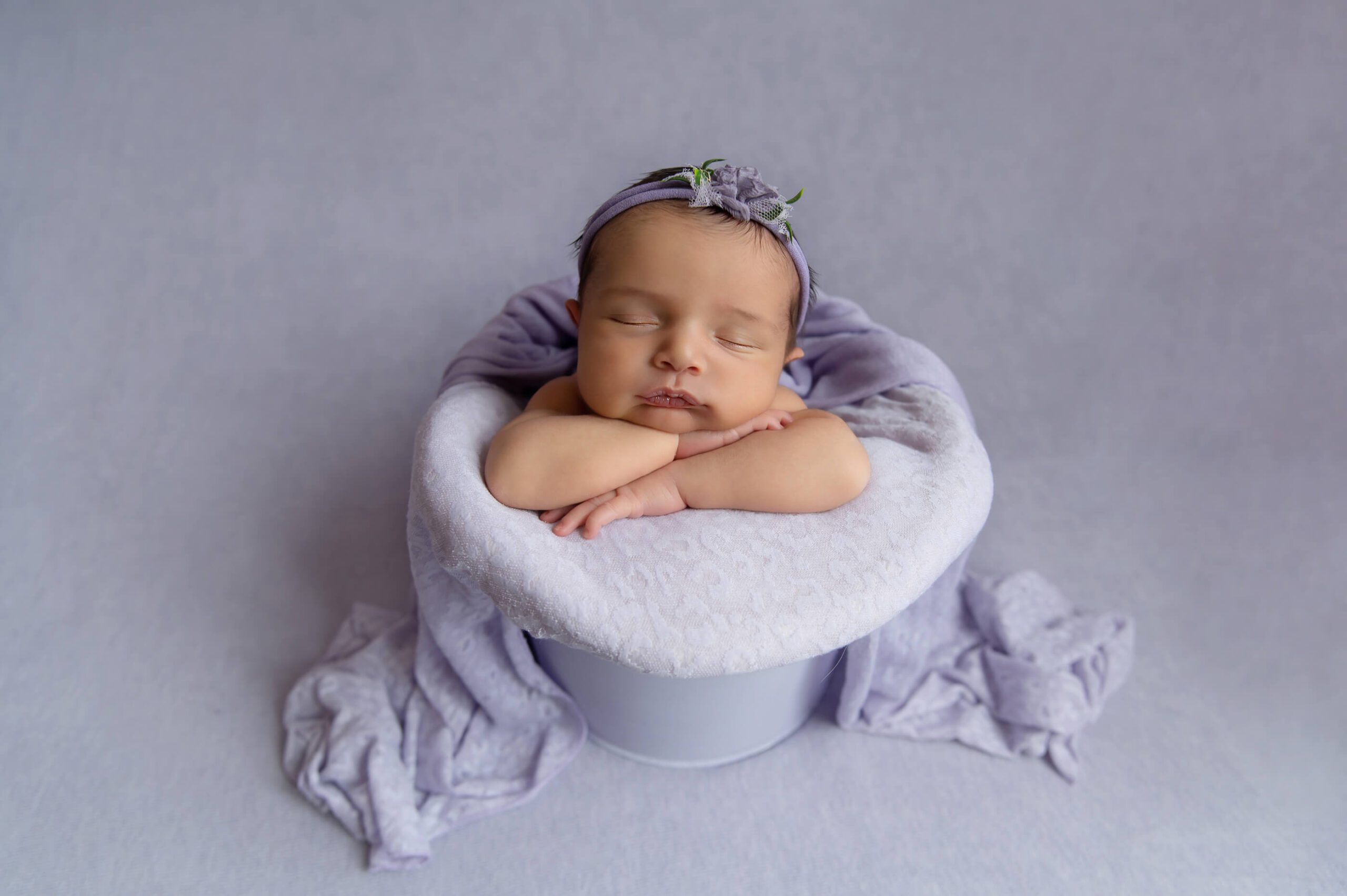 Burlington newborn photographer girl in purple in a bucket