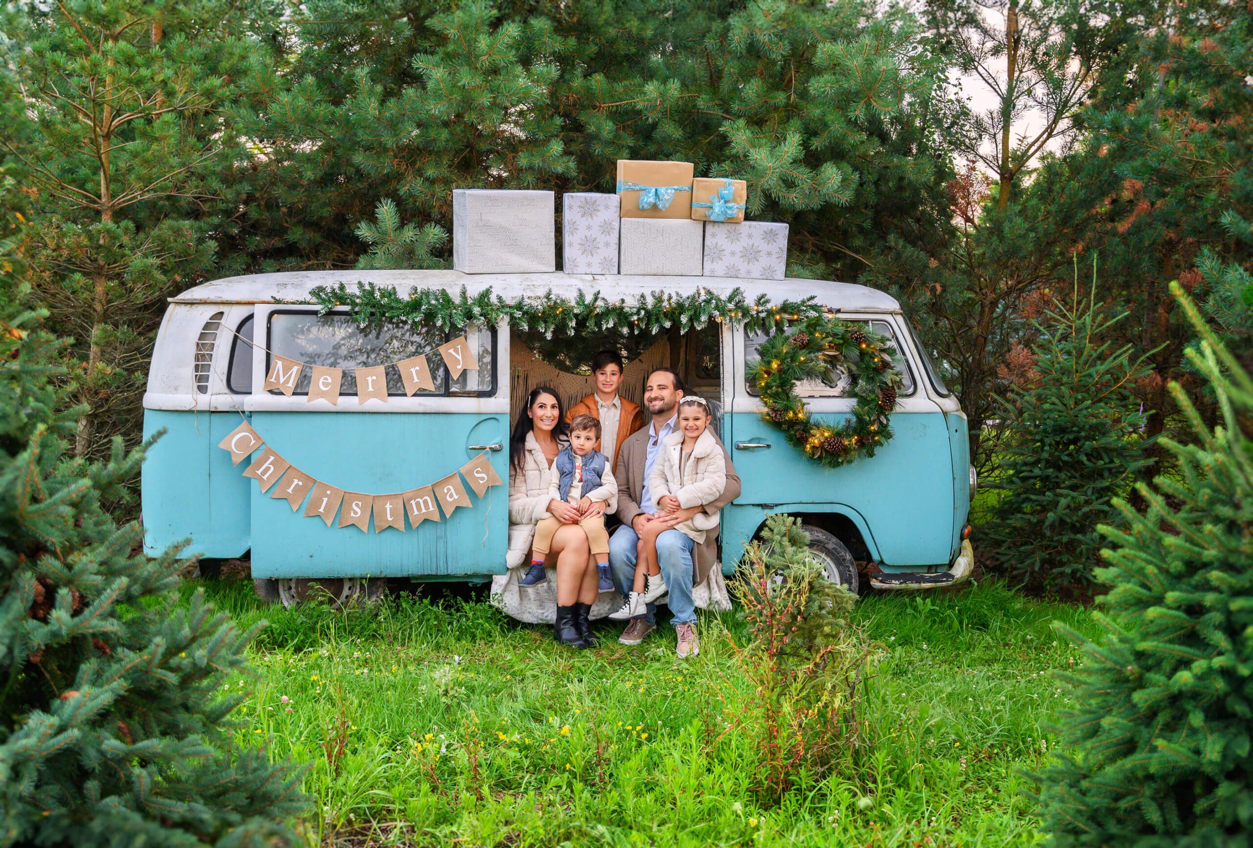 family sitting in a VW Bus for the Toronto Family Christmas Photos
