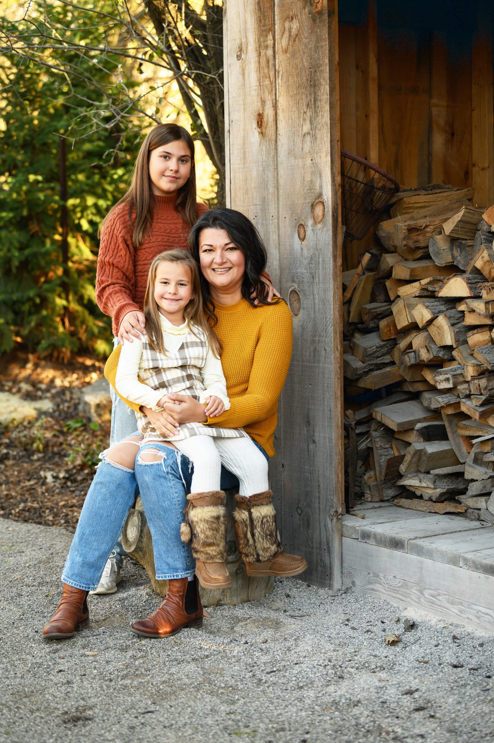 mom with two daughters for their Toronto fall family photos